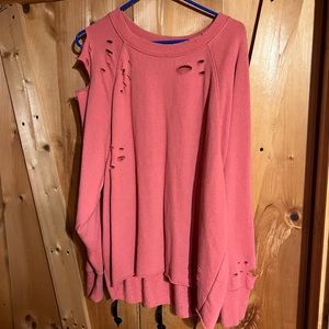 Pink ripped sweater.